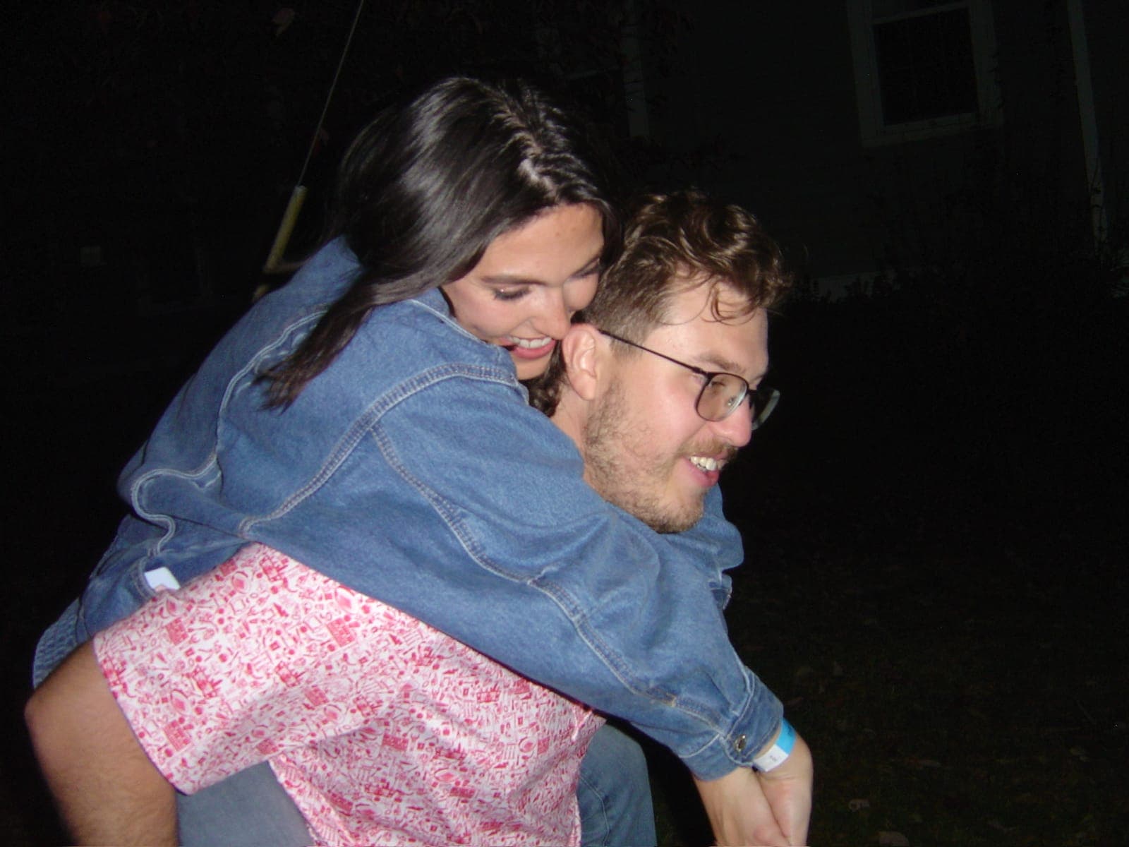 Haley cracking up as Slade gives her a piggyback ride at night